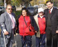 El Secretario Ejecutivo de Fonadis junto al Seremi de Agricultura y dos jóvenes con discapacidad